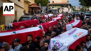 Mourners attend the funeral of 10 Lebanese killed in Israeli airstrike