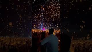 A Couple Enjoys the Beautiful Sight of the Sky During a Lantern Festival