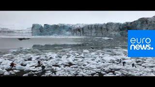 Watch: Tourists flee large wave after Icelandic glacier collapse