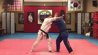 Wrist lock and punch defense