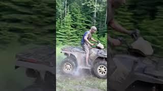 Polaris 800 full throttle into mud pit