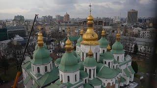 Authorities return restored golden crosses to the domes of Kyiv's St Sophia Cathedral