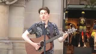 Thomas Donnelly from the band News feed playing outside North Face on Buchanan Street Glasgow