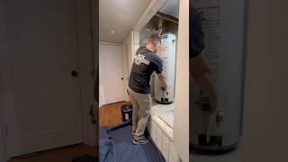 lifting a hot water heater like a man