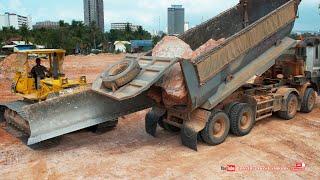 Incredible! TRAGO 25.5 ton dump trucks dumping huge rocks with Komatsu D68E bulldozer pushing rocks