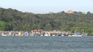 Mandovi River with long bridge over it near Panjim in Goa, boats ply along riverine stretch