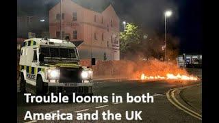 In both America and the UK, we see the opening shots of what looks like a  low-level civil war