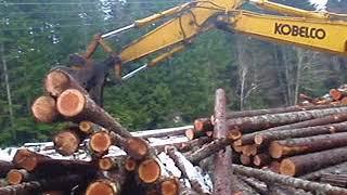 logging cat skidder 518 pulling logs