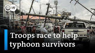 Nearly 400 dead as Philippines reels from Typhoon Rai | DW News