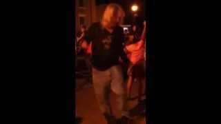 Man dancing wildly to AC/DC