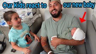 OUR KIDS REACT TO OUR NEW BABY BOY!